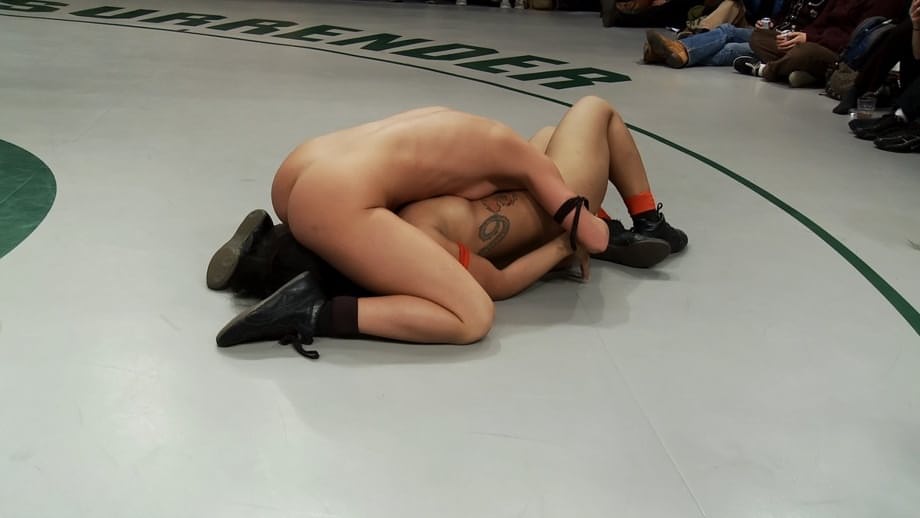 Wrestlers give up a bout to begin being masturbated by a referee
