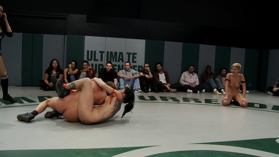 Wrestlers give up a bout to begin being masturbated by a referee