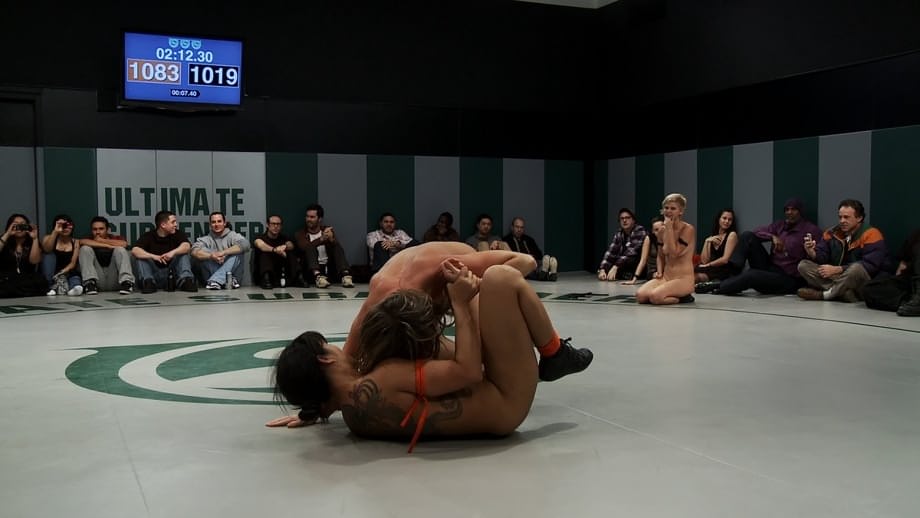 Wrestlers give up a bout to begin being masturbated by a referee