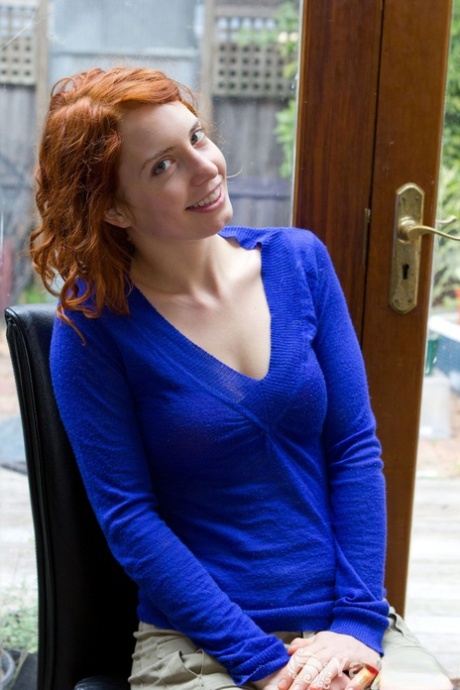 Cute redhead Kara Dashka shows her pale natural tits & spreads at the window