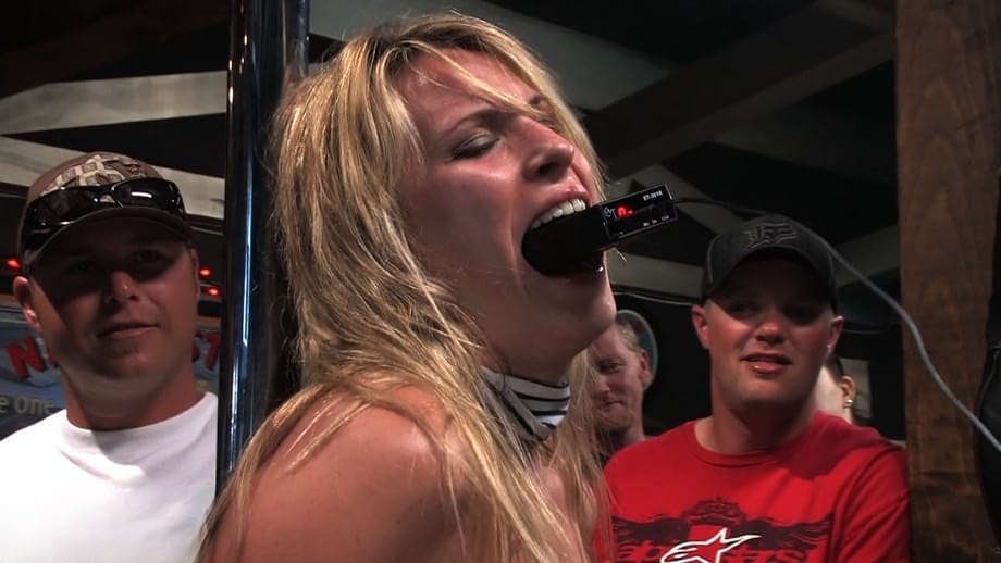 Cute sexy blonde is masturbated while being gangbanged in a bar