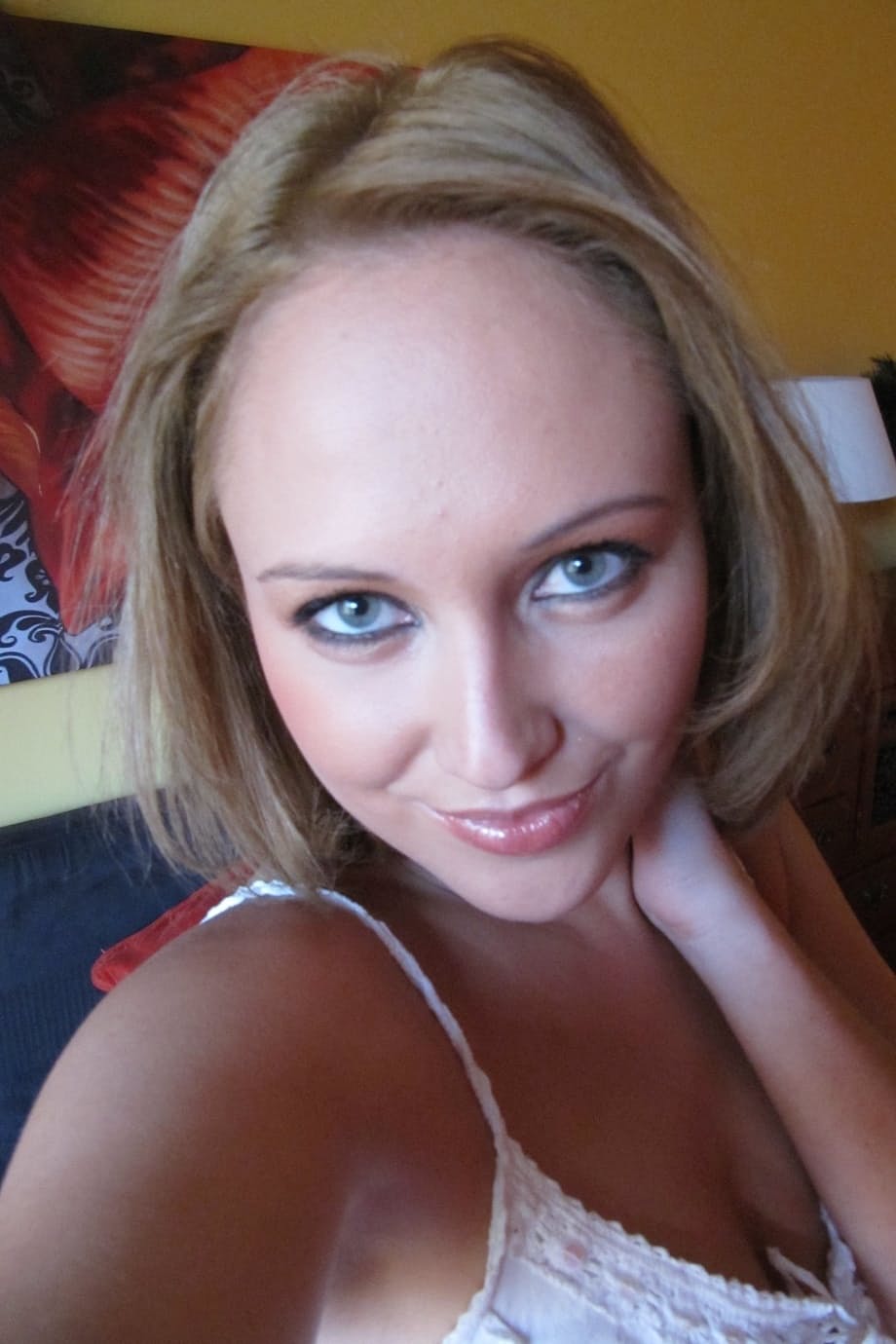 Middle-aged beauty removes her lingerie to set her perky boobs free