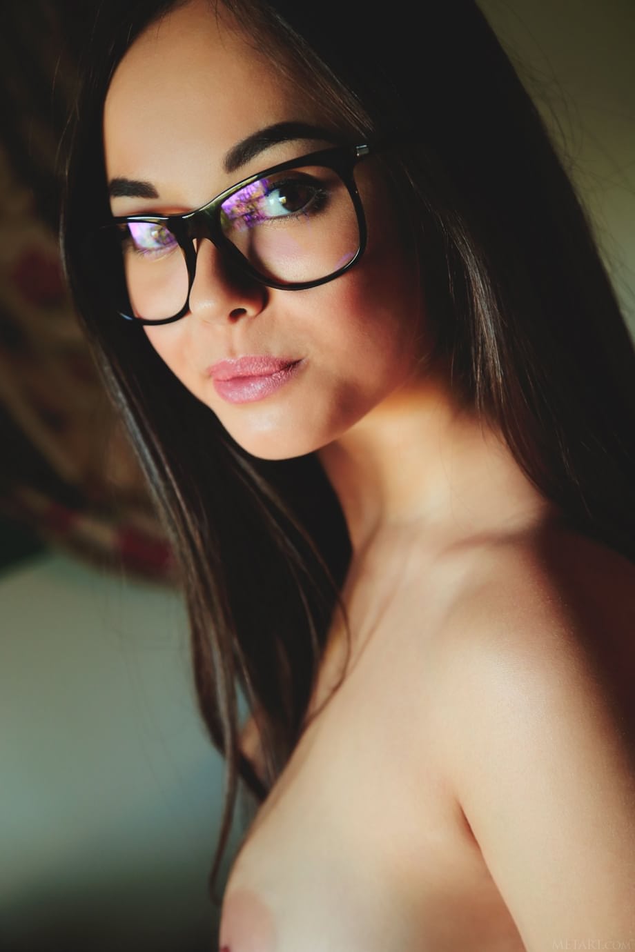 Sultry solo girl Li Moon displays her perfect pussy while reading a book