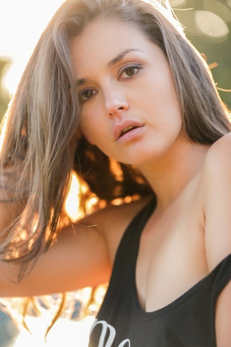 Sexy Allie Haze taking tiny jean shorts off and showing trimmed cunt outdoors