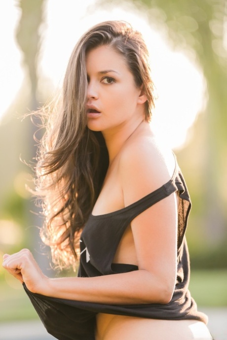 Sexy Allie Haze taking tiny jean shorts off and showing trimmed cunt outdoors