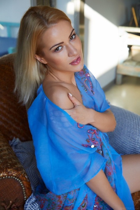 Nice blonde teen Cherry Kiss shows her landing strip pussy while in the nude
