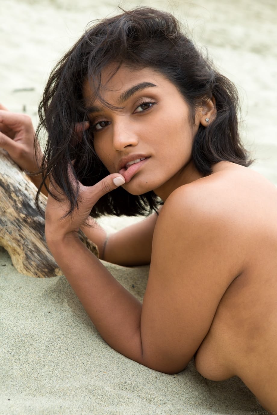 Gorgeous teen Angel Constance unveils her cute titties and poses on the beach