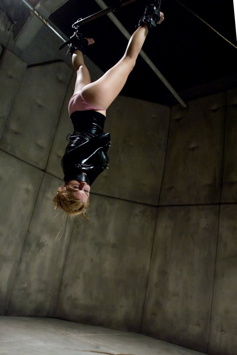 Lexi Belle gets fucked after giving a blowjob while hanging from a ceiling