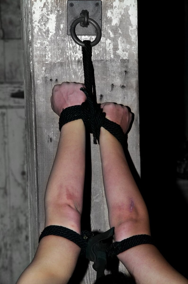 Bound brunette Alexa Von Tess getting her bald snatch toyed in the dungeon