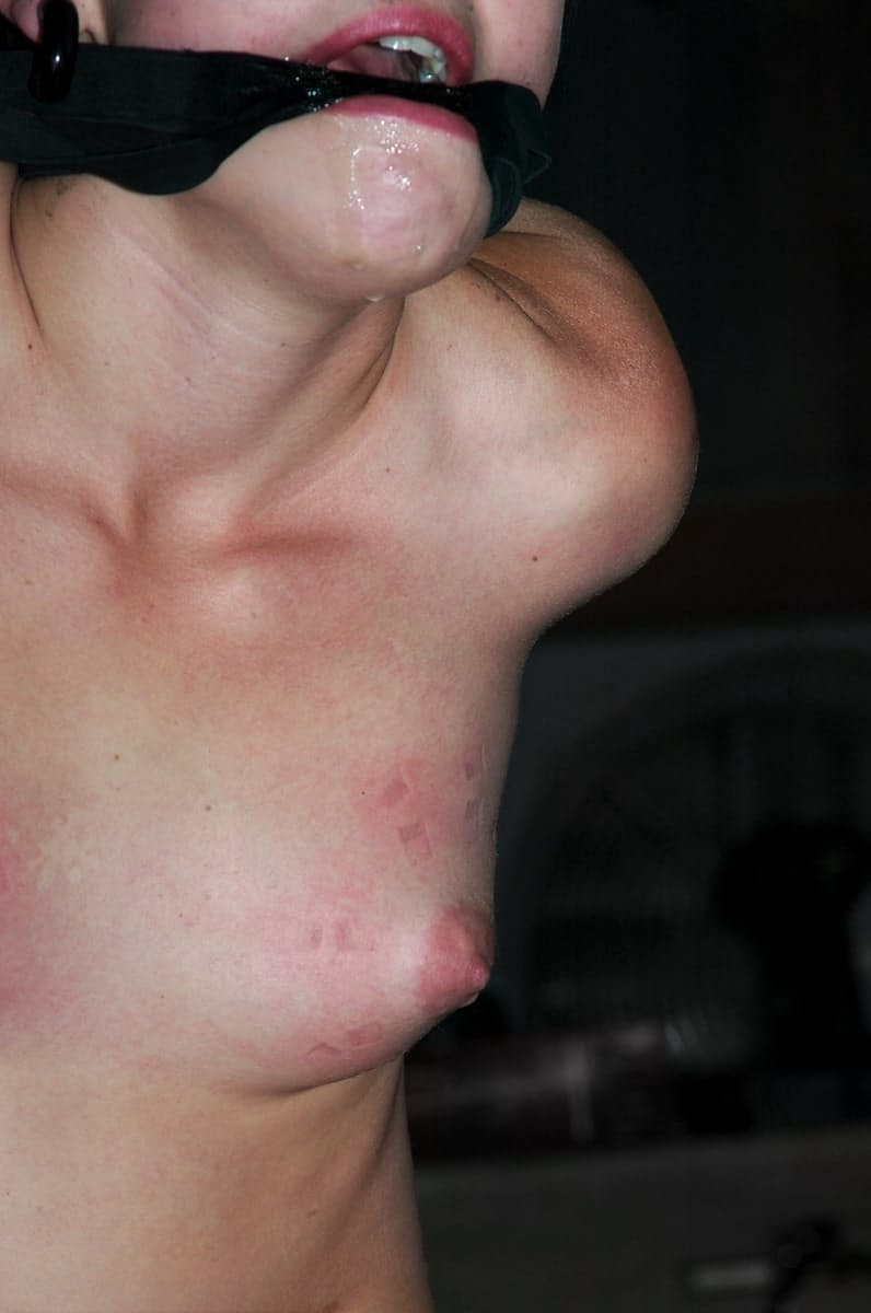 Bound brunette Alexa Von Tess getting her bald snatch toyed in the dungeon