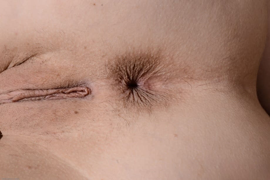 Exotic teen Rina Ellis shows her shaved vagina and teases on a chair