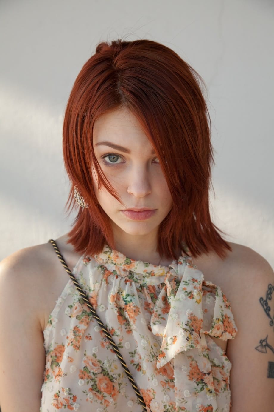 Redheaded teen Bree Daniels shows her slim body and poses in pink lingerie