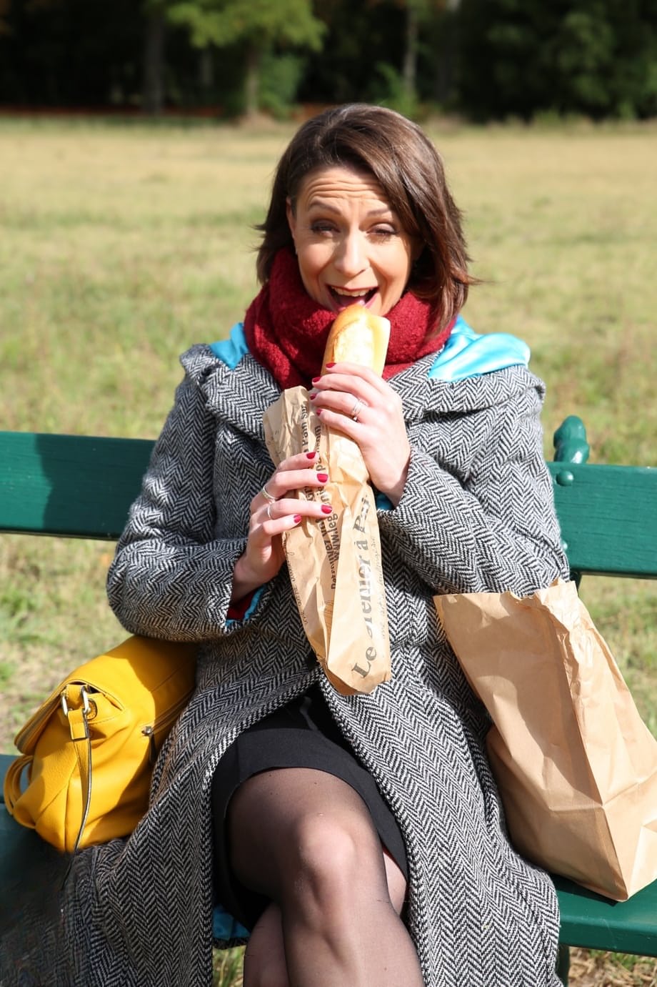 French mom Anya flashes her legs in stockings while eating a sandwich outside