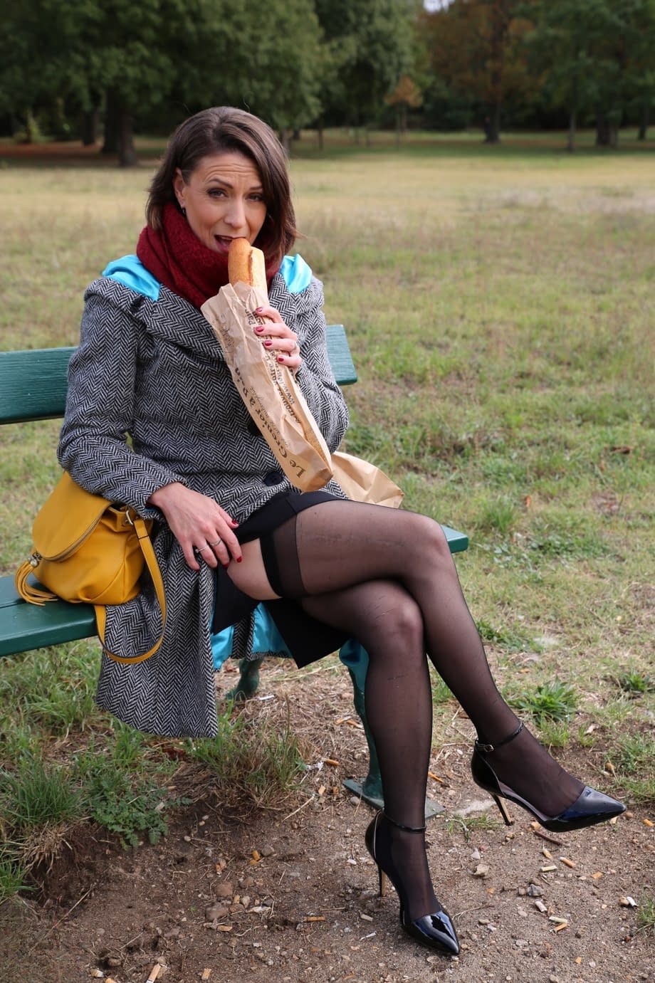 French mom Anya flashes her legs in stockings while eating a sandwich outside