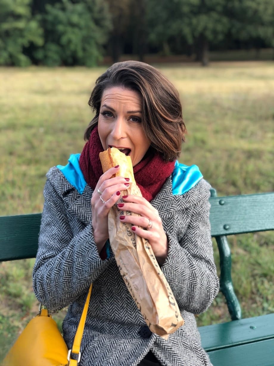 French mom Anya flashes her legs in stockings while eating a sandwich outside
