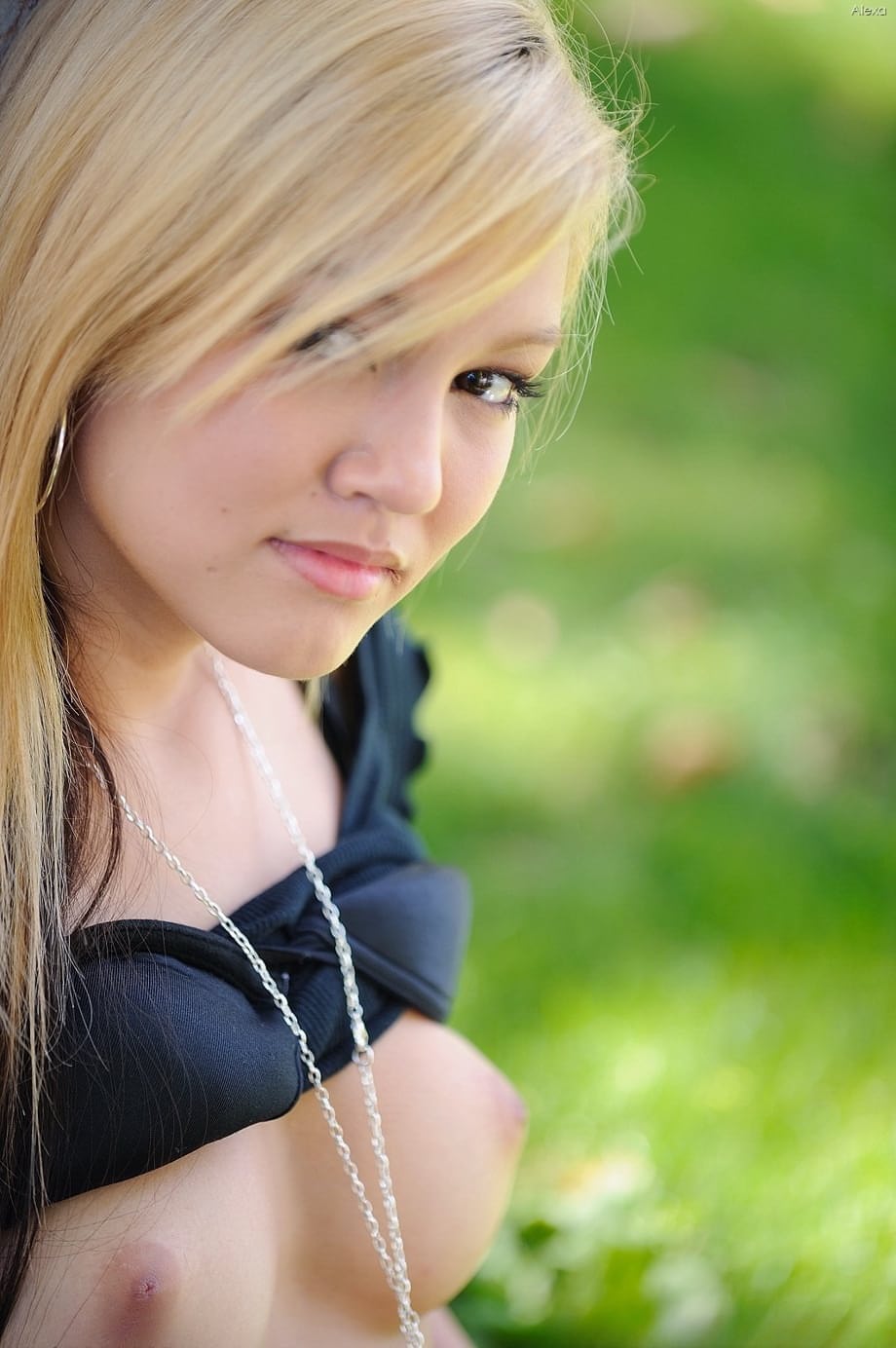Amateur blonde Alexa bares her tasty nipples and masturbates below a tree