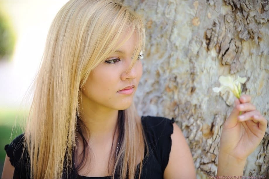 Amateur blonde Alexa bares her tasty nipples and masturbates below a tree
