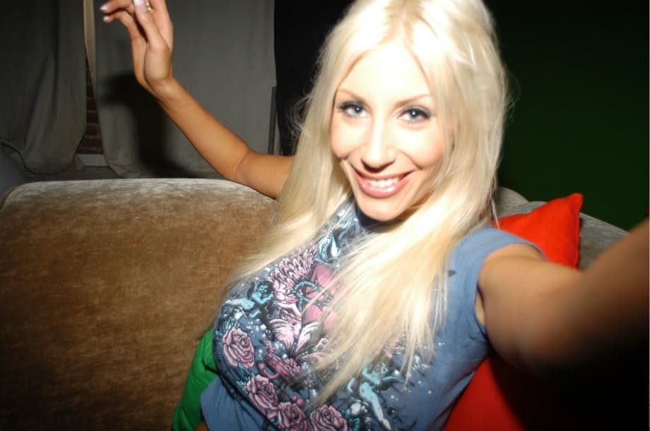 Naughty blonde babe Puma Swede uncovers her big tits while smoking