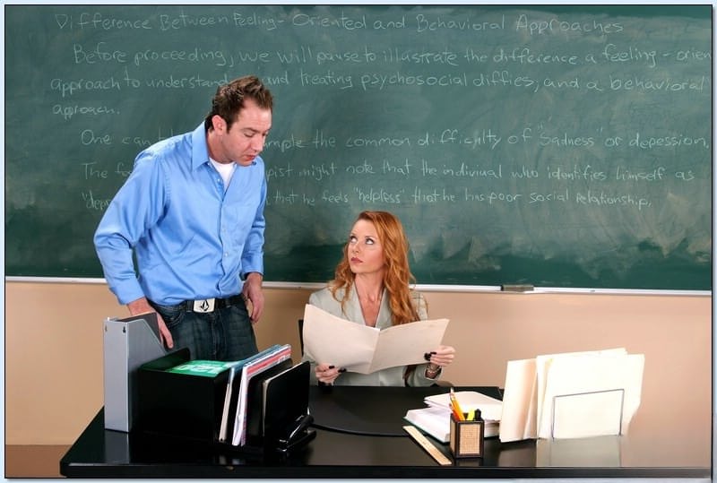 Redheaded teacher Janet Mason seduces a guy and gets fucked at school