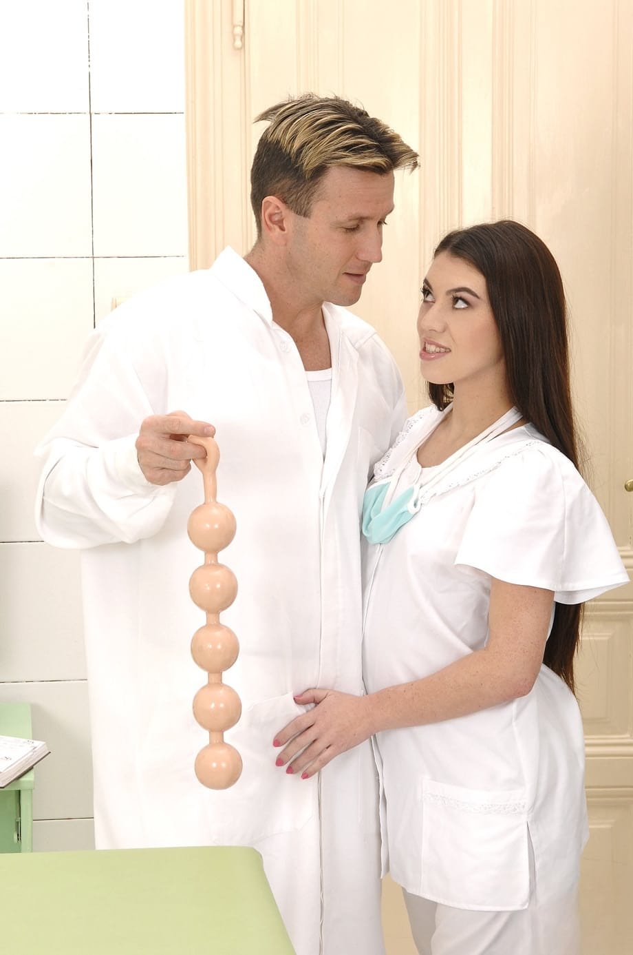 Beautiful French nurse Tiffany Doll gets her beaver toyed by a horny doc