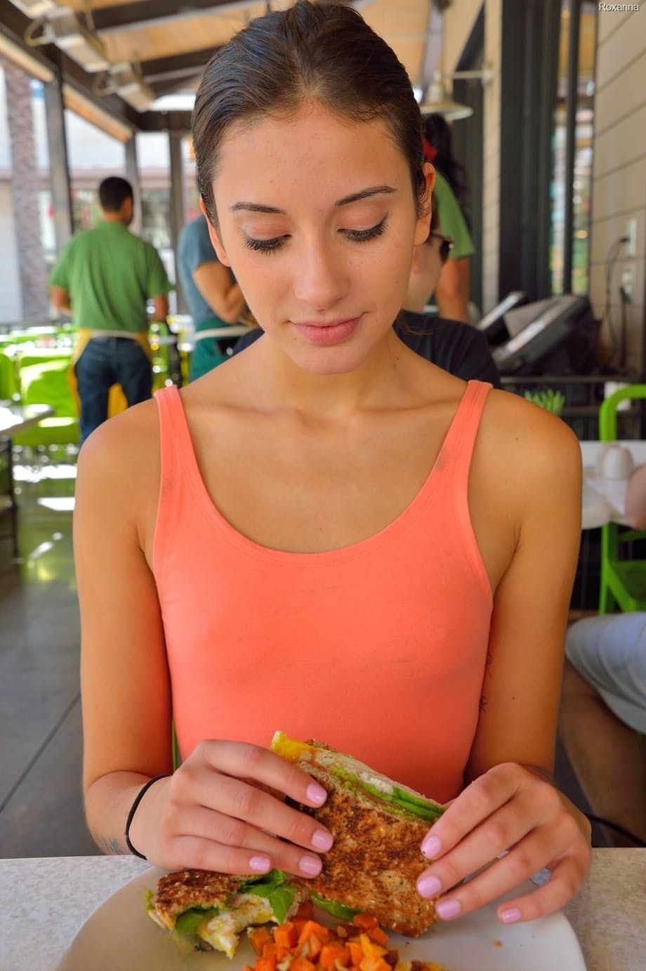 Adorable skinny teen Roxanna flashes her trimmed vagina in public