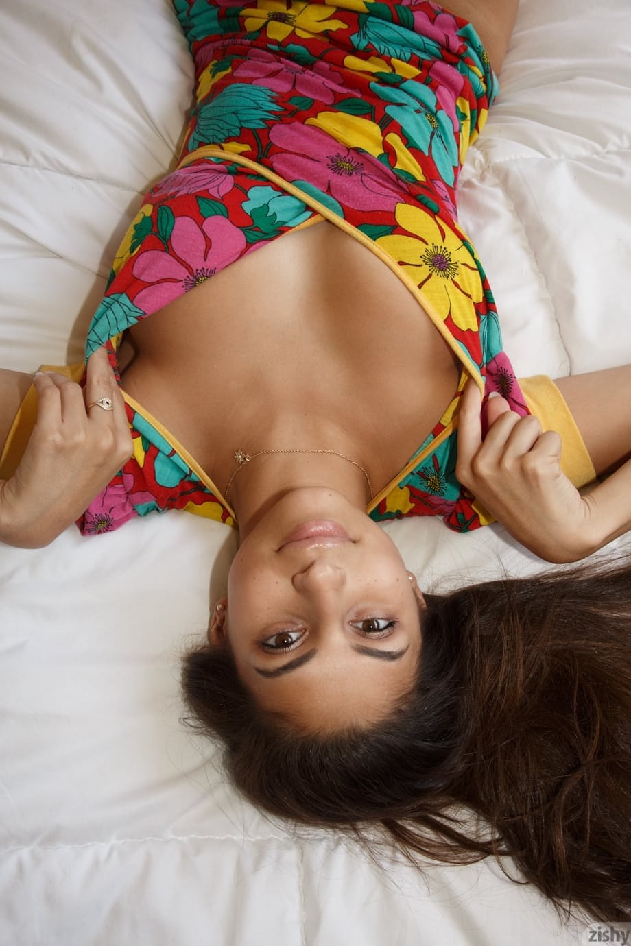 Cute Latina teen Nina North gets totally naked on a bed after eating out