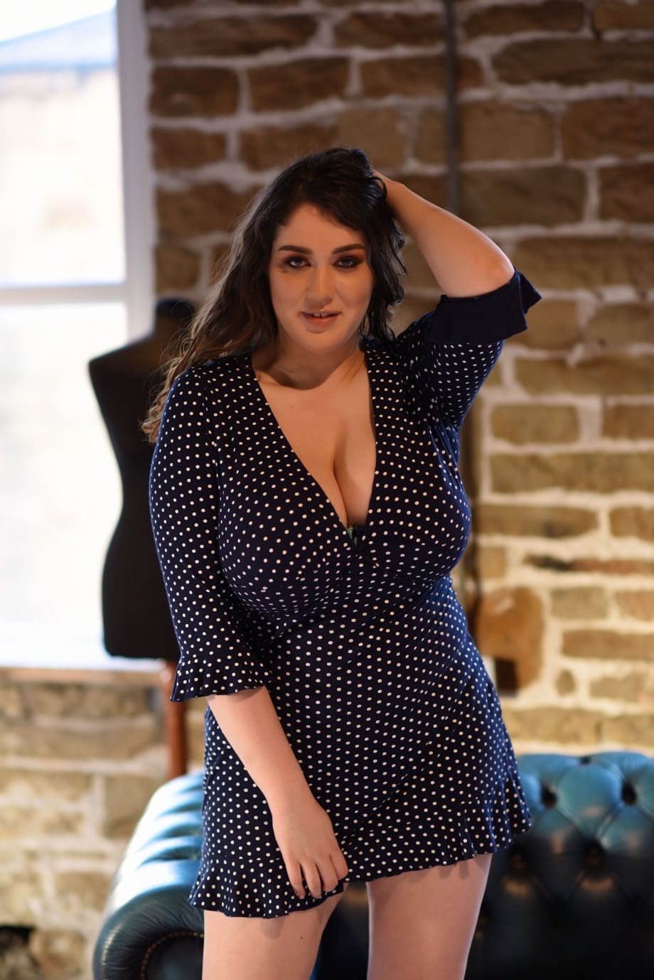 Thick brunette Bella B reveals her large melons and poses topless