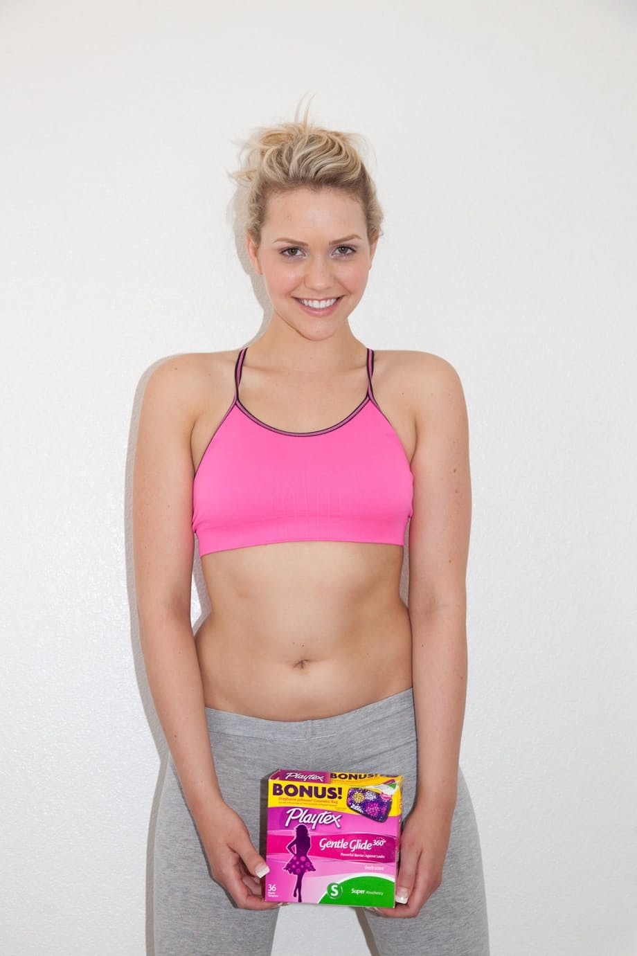 Blonde girlfriend Mia Malkova covers her nice tits while promoting a product