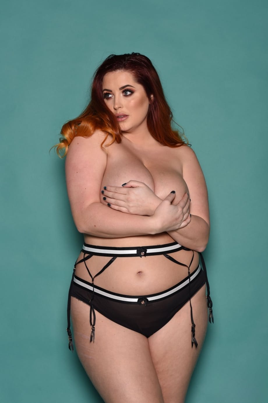 Plump British redhead Lucy Vixen flaunts her all natural phenomenal boobs