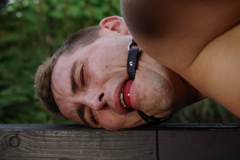 Romanian femdom Sandra Romain slaps and fucks her slave's ass on the bridge