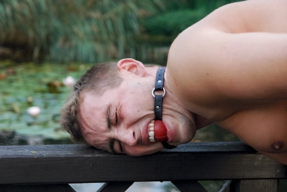 Romanian femdom Sandra Romain slaps and fucks her slave's ass on the bridge
