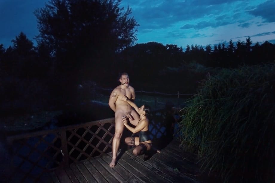 Romanian femdom Sandra Romain slaps and fucks her slave's ass on the bridge