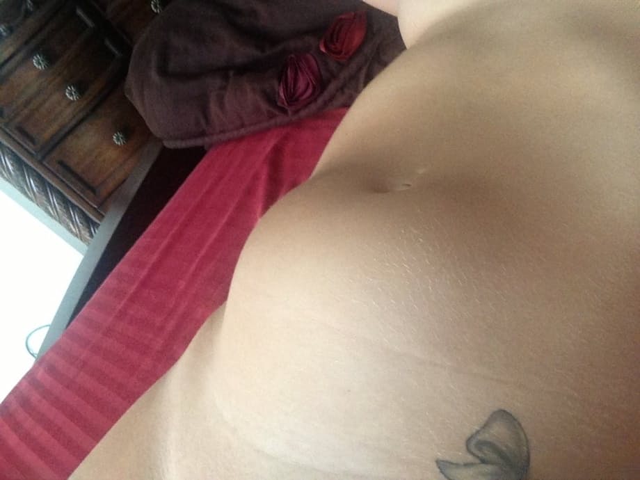 Big-boobed pregnant blonde Melissa taking selfies in the mirror