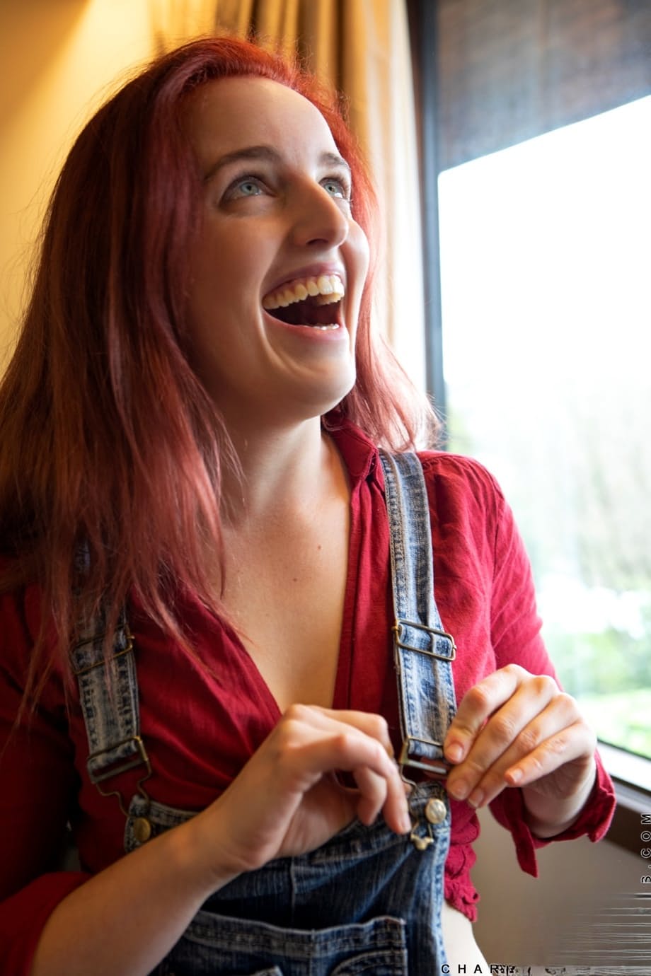 Redheaded MILF with natural tits Charlie Forde strips to take nude selfies