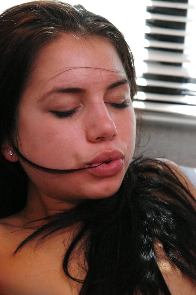 Brunette babe Micah Moore masturbates using sex toys during a BDSM performance