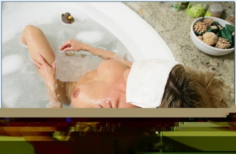 MILF slut Brandi Love gives a blowjob in the tub & gets fucked in a POV scene
