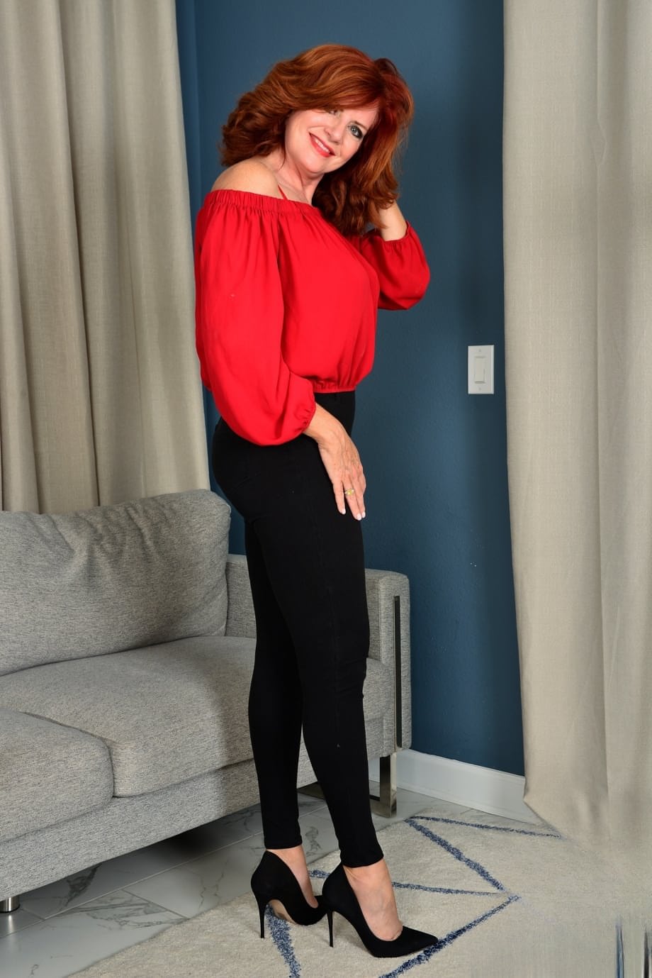 Mature ginger Andi James strips and shows her juicy boobs & fuzzy snatch