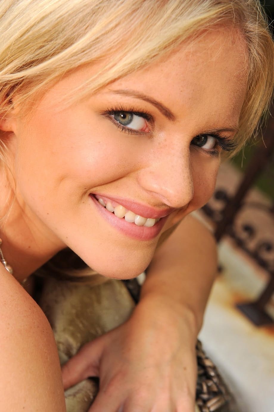 Blonde sweetie Charley G reveals her fabulous breasts and fondles her feet