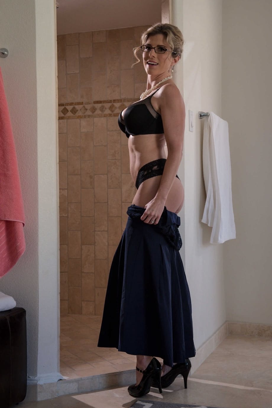 Nerdy MILF Cory Chase doffs her dress and flaunts her great fake tits