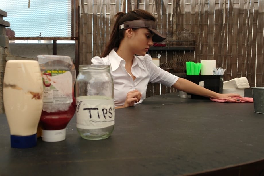 Bored waitress Sasha Grey tries out sex toys in the back room at work