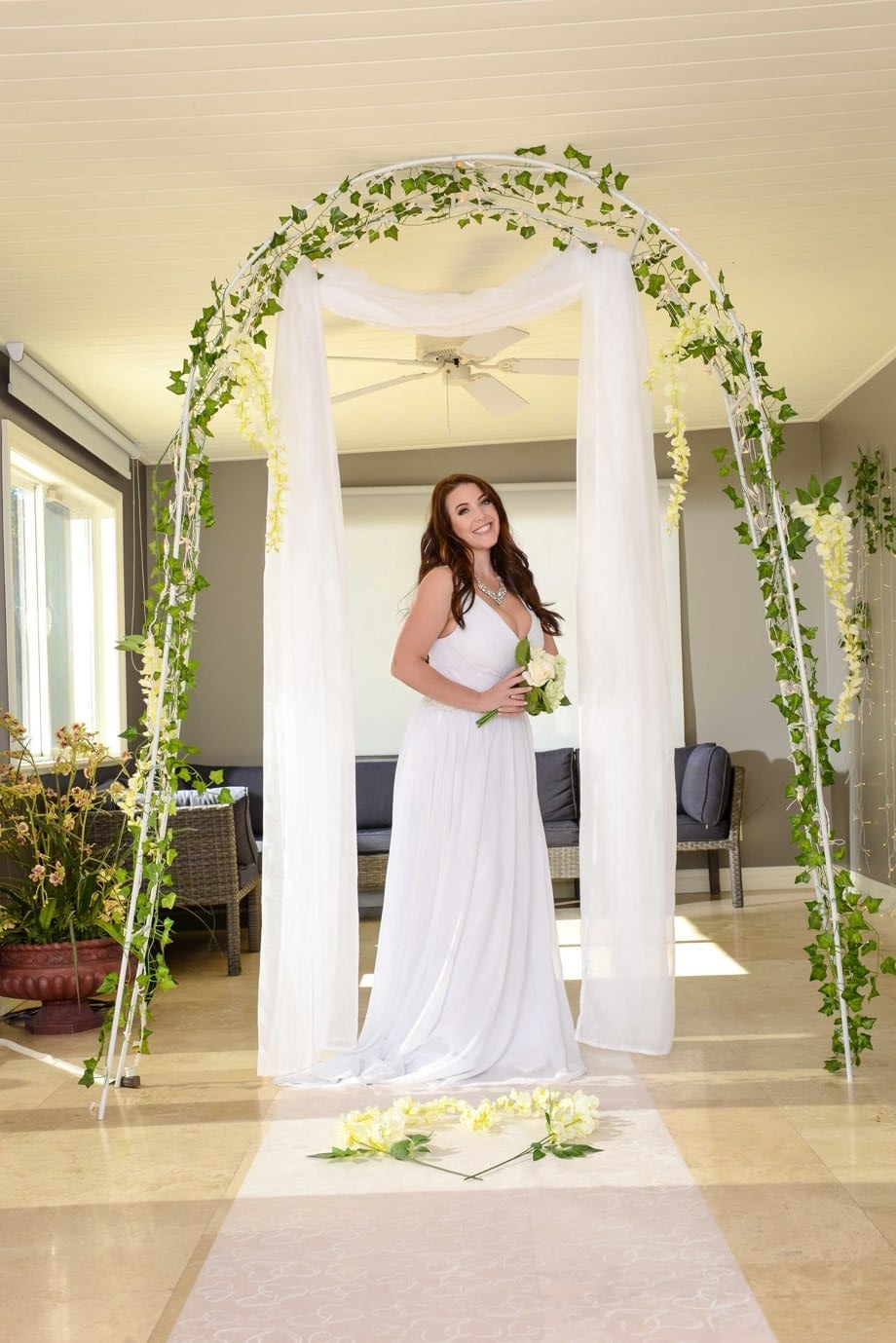 Buxom bride Angela White lets out her huge breasts and flashes her fat ass