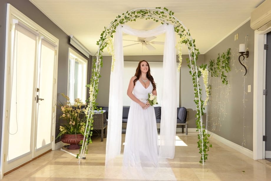Buxom bride Angela White lets out her huge breasts and flashes her fat ass