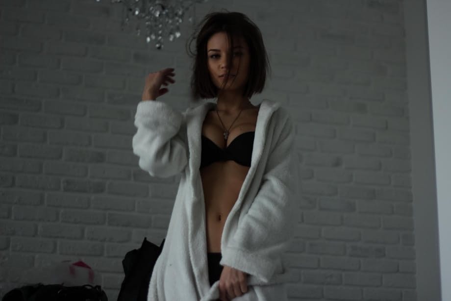 Babe takes off bathrobe and puts on superman uniform over elegant lingerie