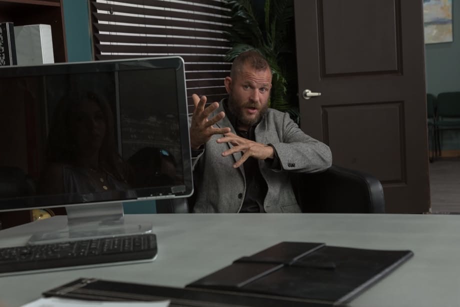Office worker Lena Paul shows her big boobs before sex over her desk