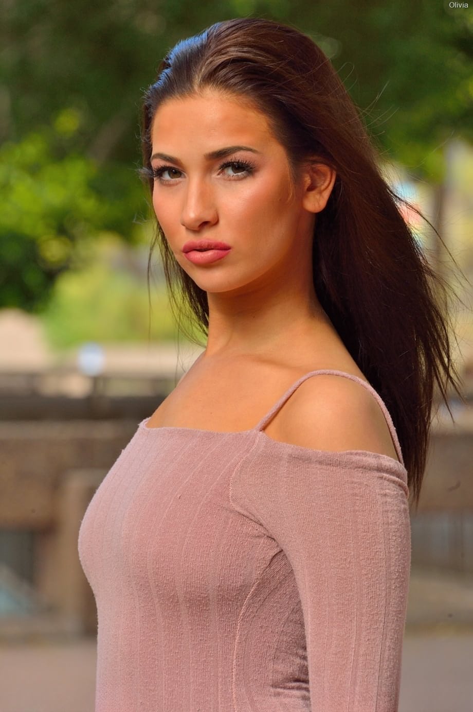 Hot girl Olivia Nova pulls down her dress to expose her ass in public