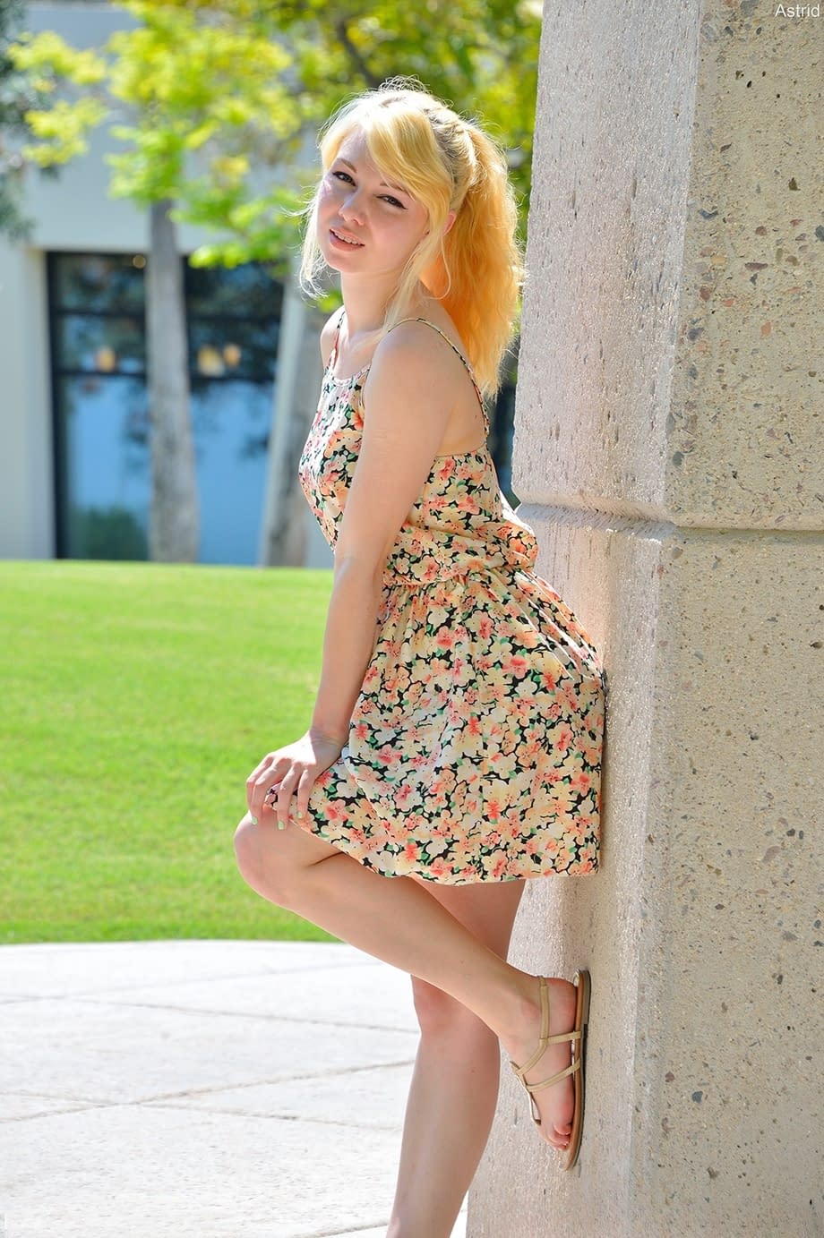 Blonde cutie Astrid reveals her titties and flashes her pussy in public