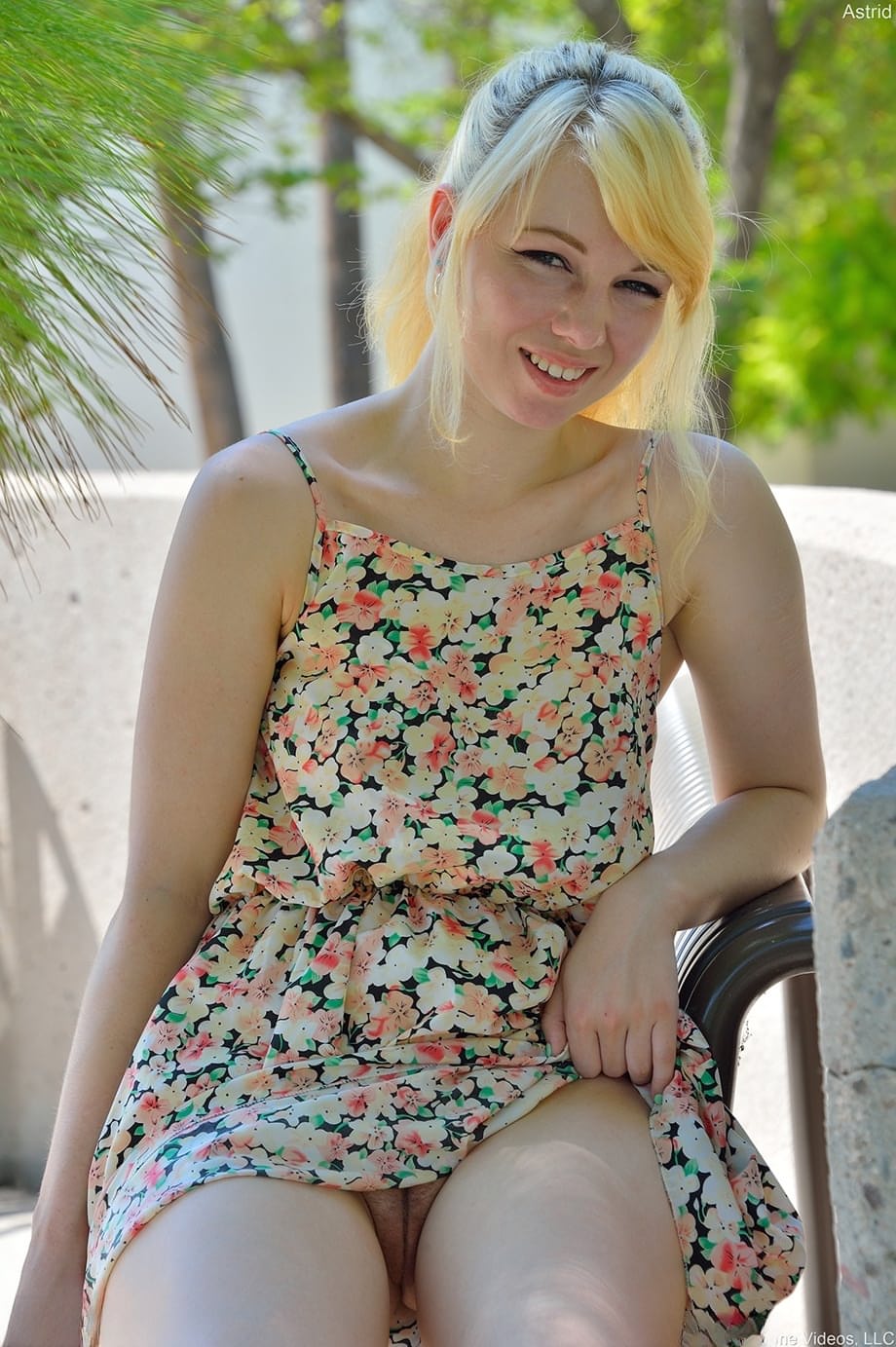 Blonde cutie Astrid reveals her titties and flashes her pussy in public