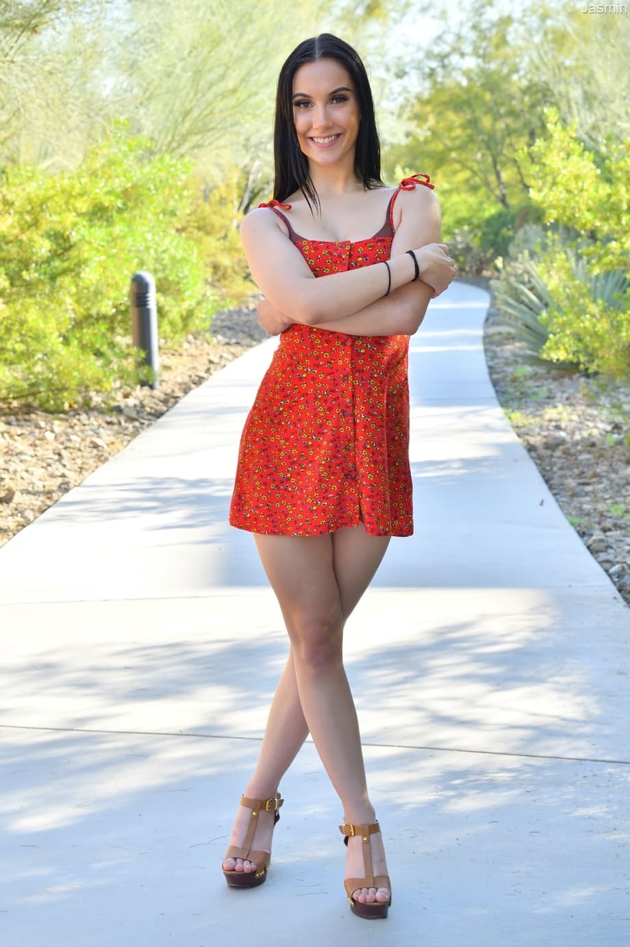 Cute brunette girl Jasmin shows her hot figure before toying herself indoors