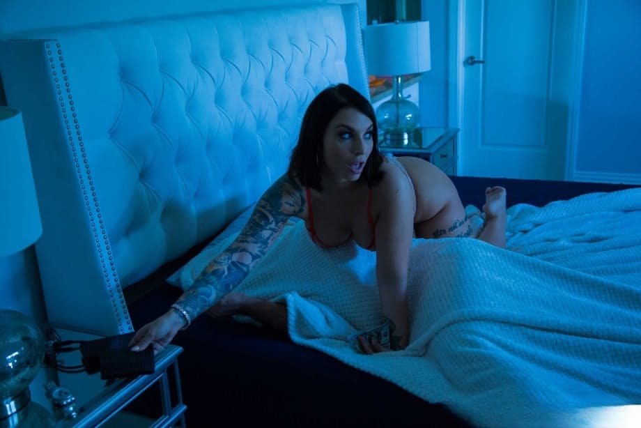 Busty inked MILF Ivy LeBelle exposing her figure and fake breasts in a solo