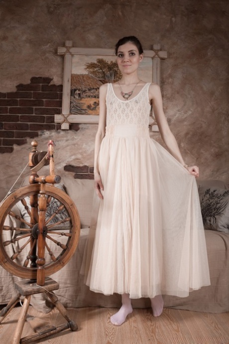 Pale girl removes a white dress before showing her hairy armpits and pussy